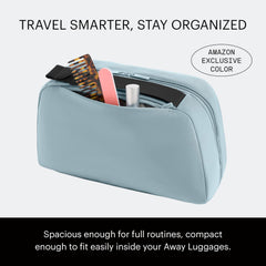 Away toiletry bag clamshell open displaying full access and organized layout