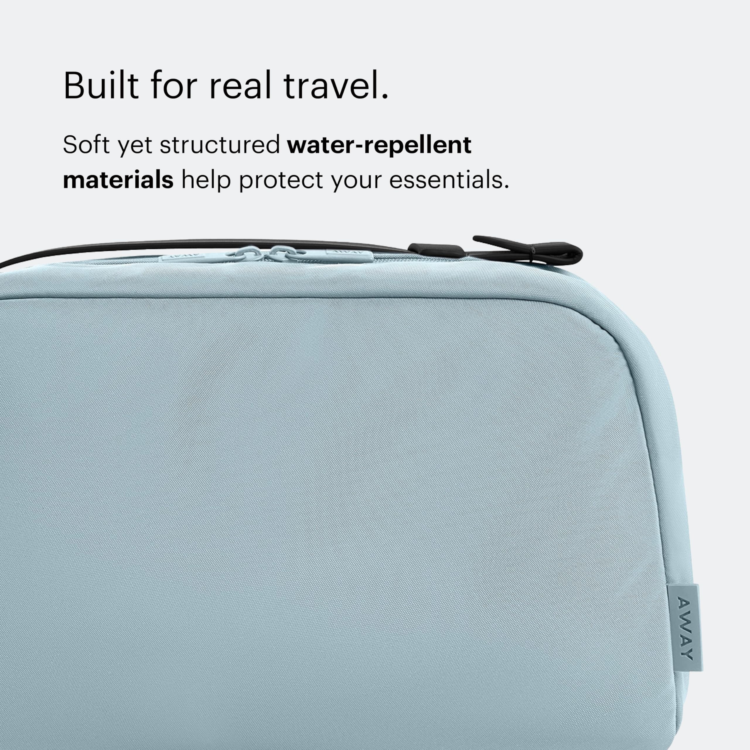 Away toiletry bag elastic toothbrush loop and exterior zip pocket for quick access