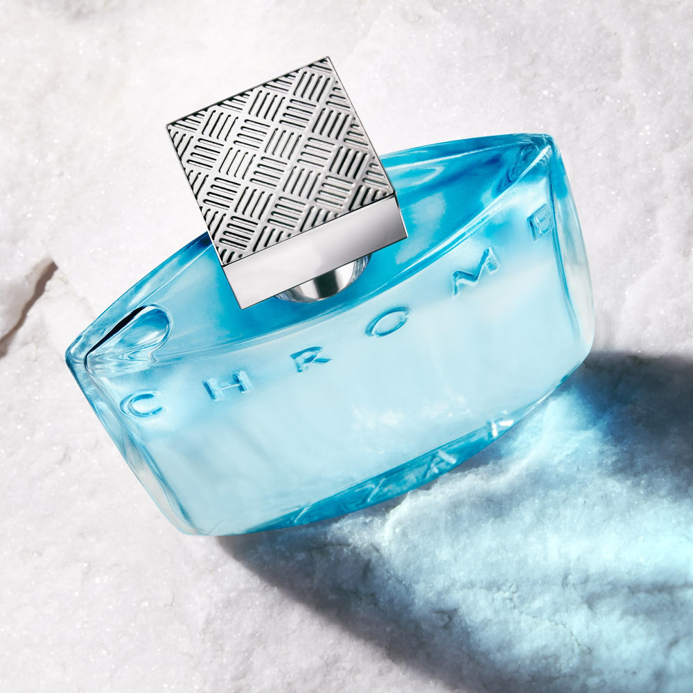 Azzaro Chrome next to travel items showing portable convenience