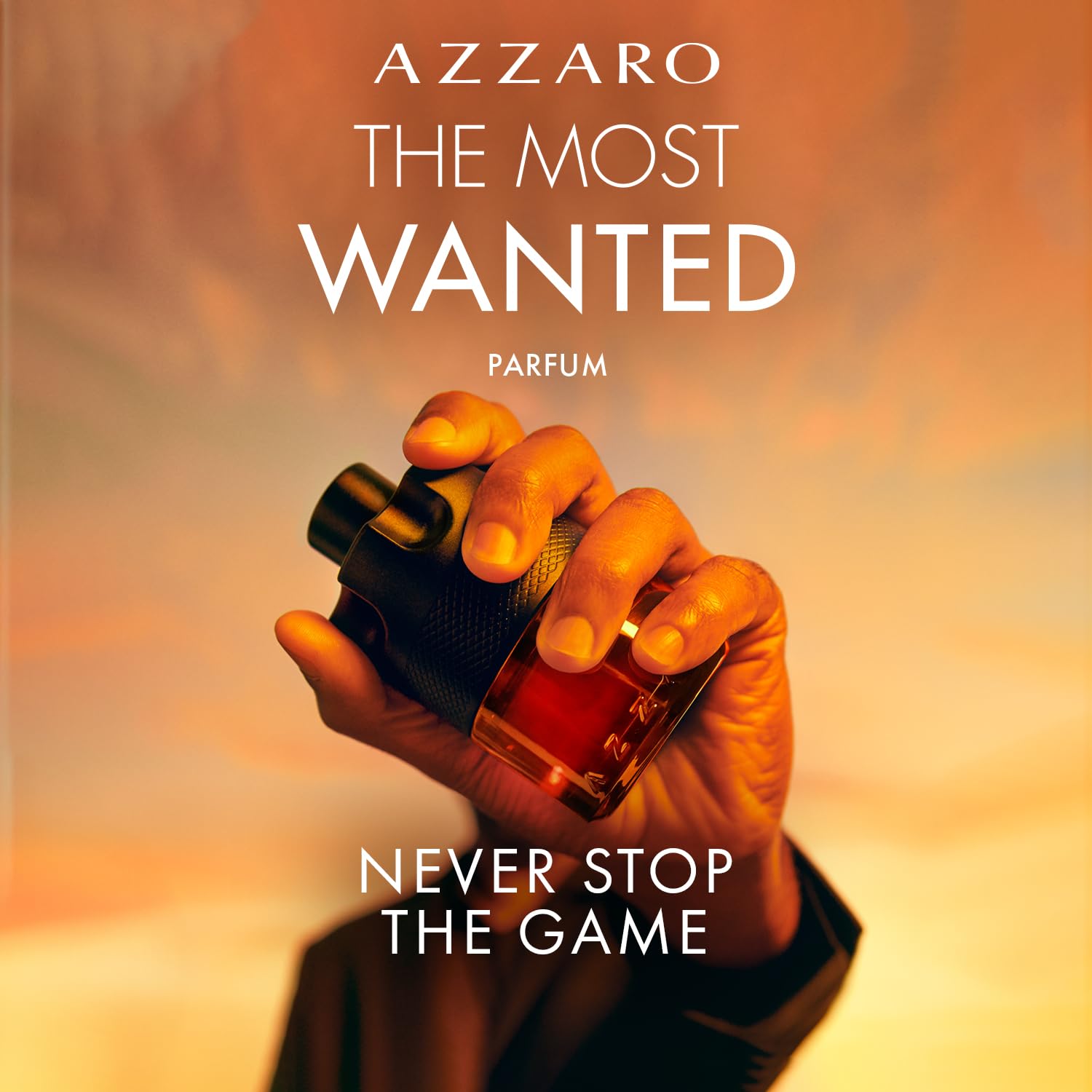 Azzaro spraying cologne on wrist demonstrating easy application and projection
