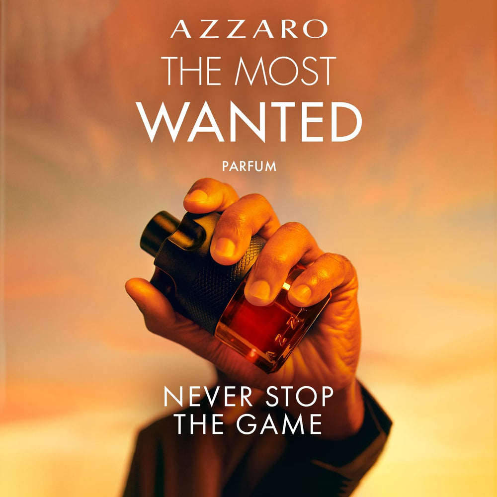 Azzaro spraying cologne on wrist demonstrating easy application and projection