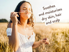 Babo Botanicals close-up of oat extract drops, soothing benefit for scalp