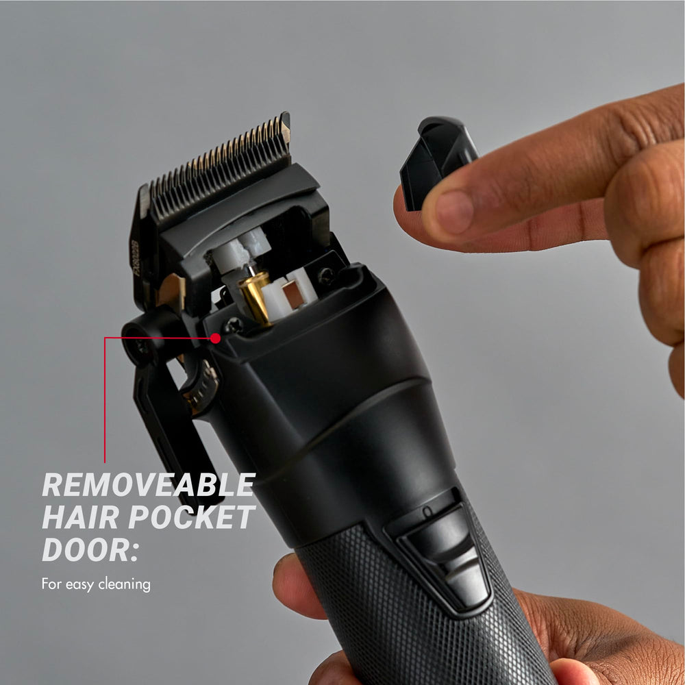 BaBylissPRO clipper held in hand for size scale and comfortable professional handling