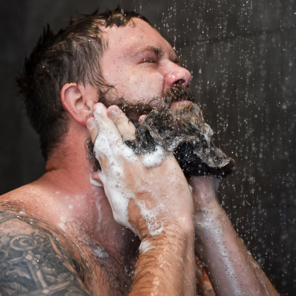 Badass Beard Care bottle on bathroom shelf suggesting daily grooming routine