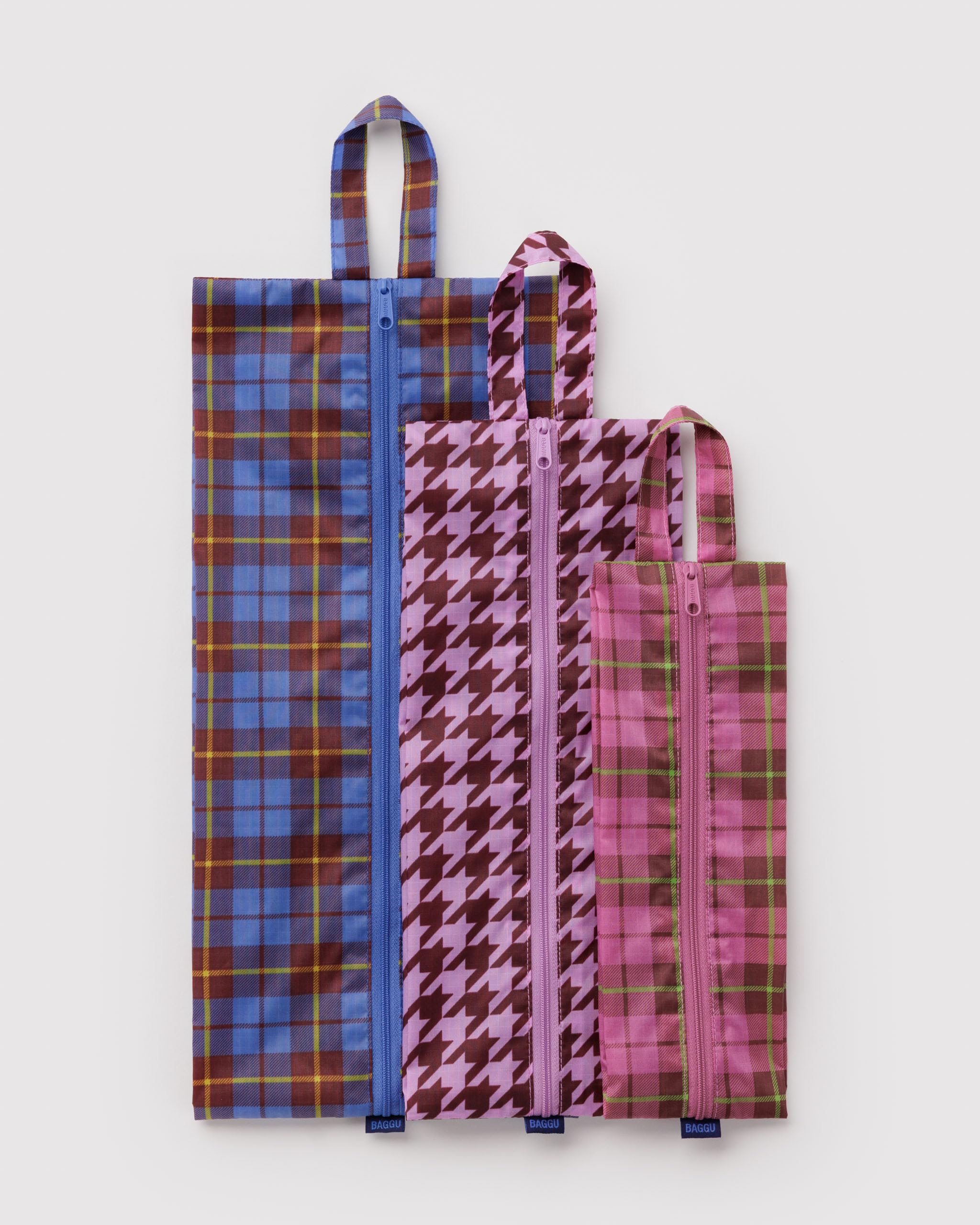 BAGGU set packed inside suitcase, shows expandable capacity and travel convenience
