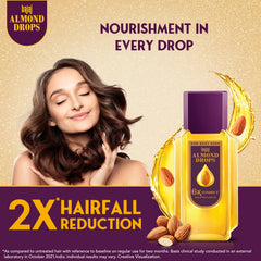 Bajaj Almond Drops oil texture drop on skin showing lightweight absorption benefit