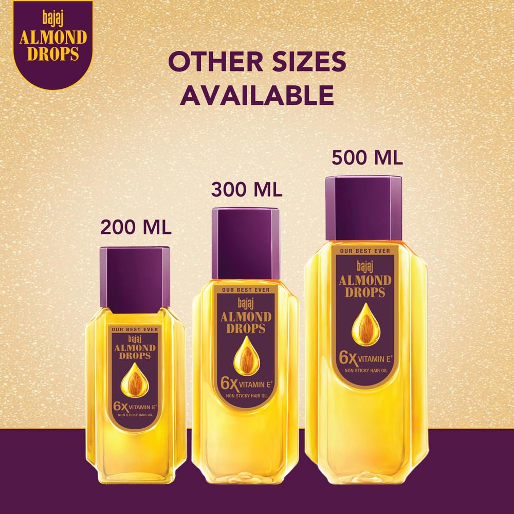 Bajaj Almond Drops next to a hand for size scale and easy 500ml handling