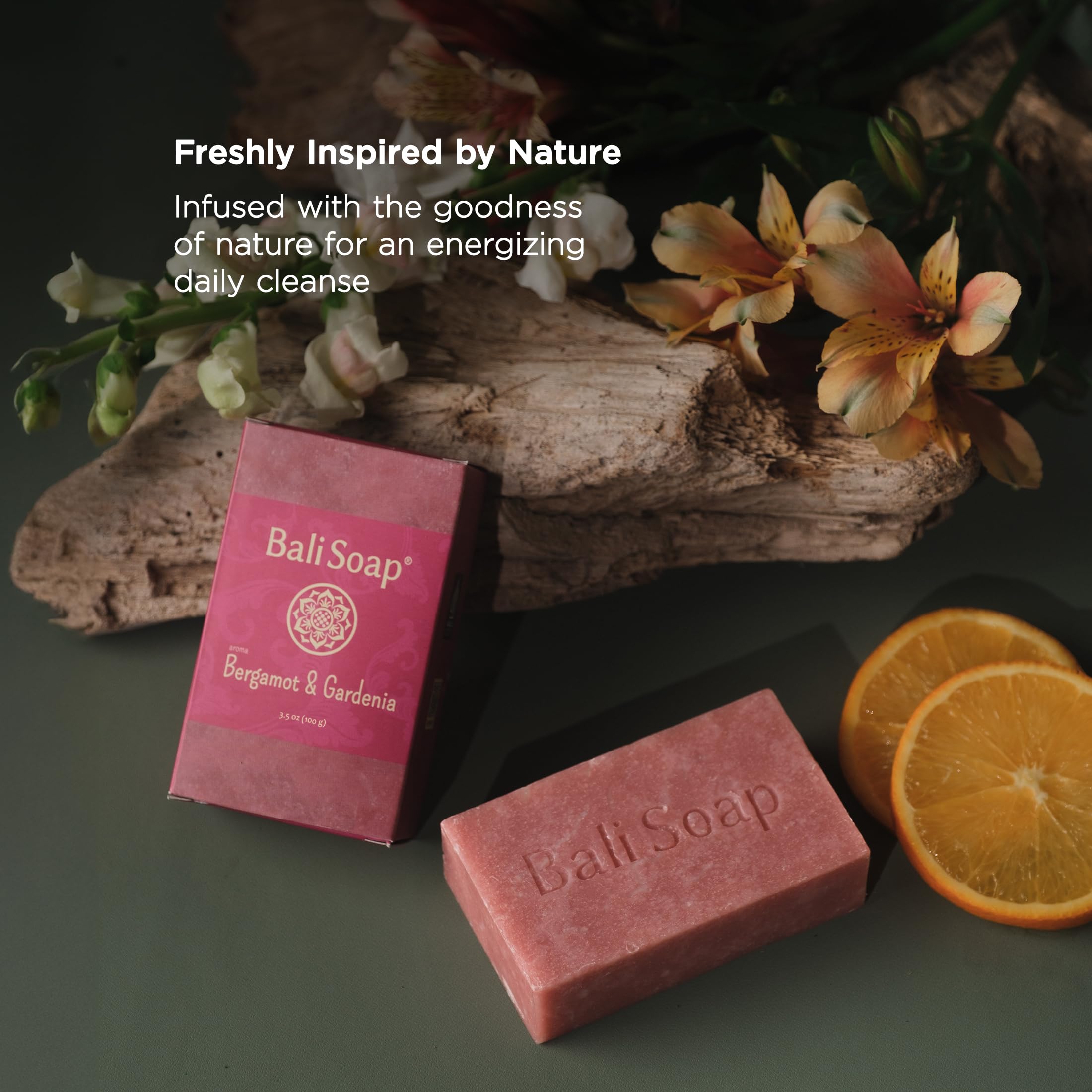 Bali Soap bar beside a hand to show true size and everyday practicality