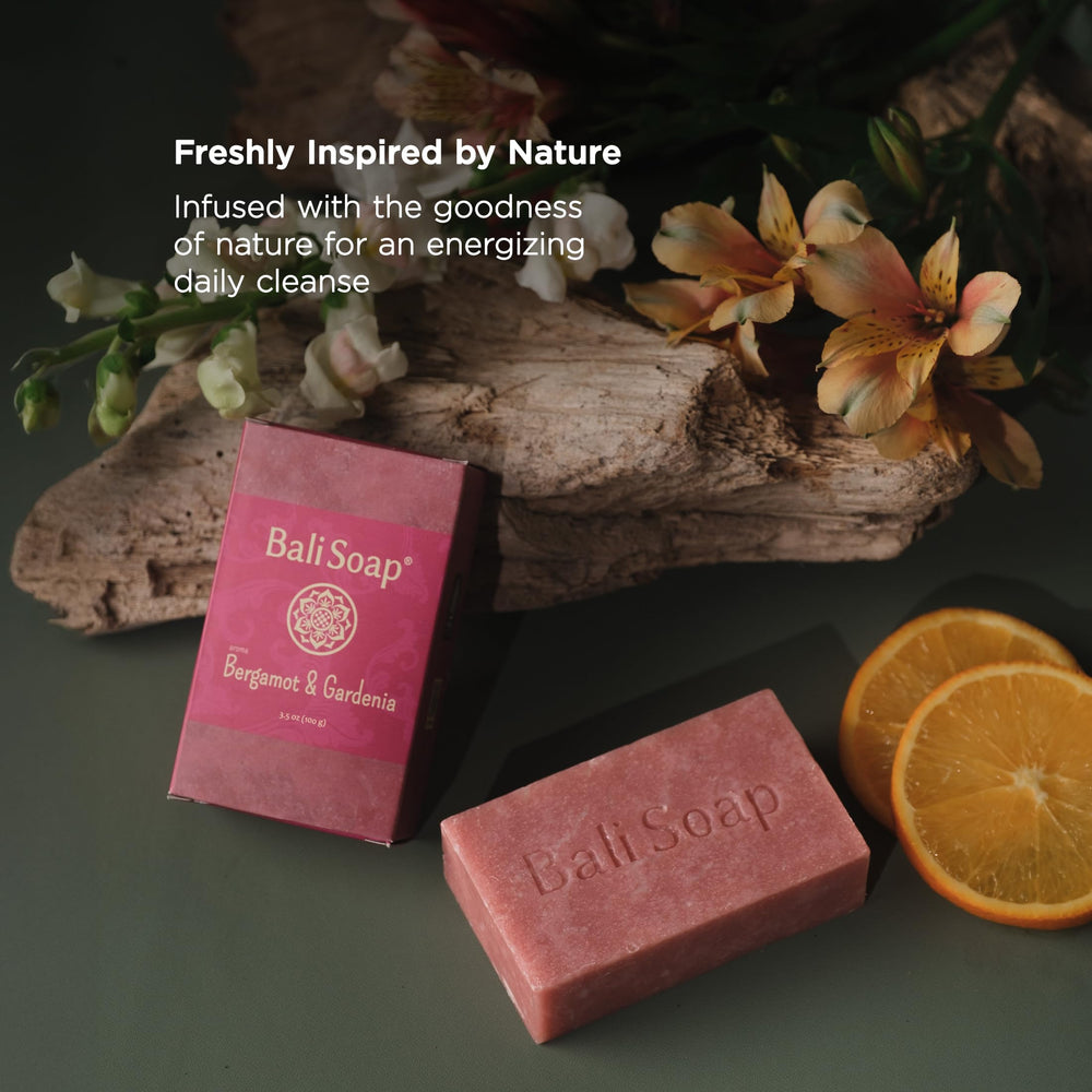 Bali Soap bar beside a hand to show true size and everyday practicality