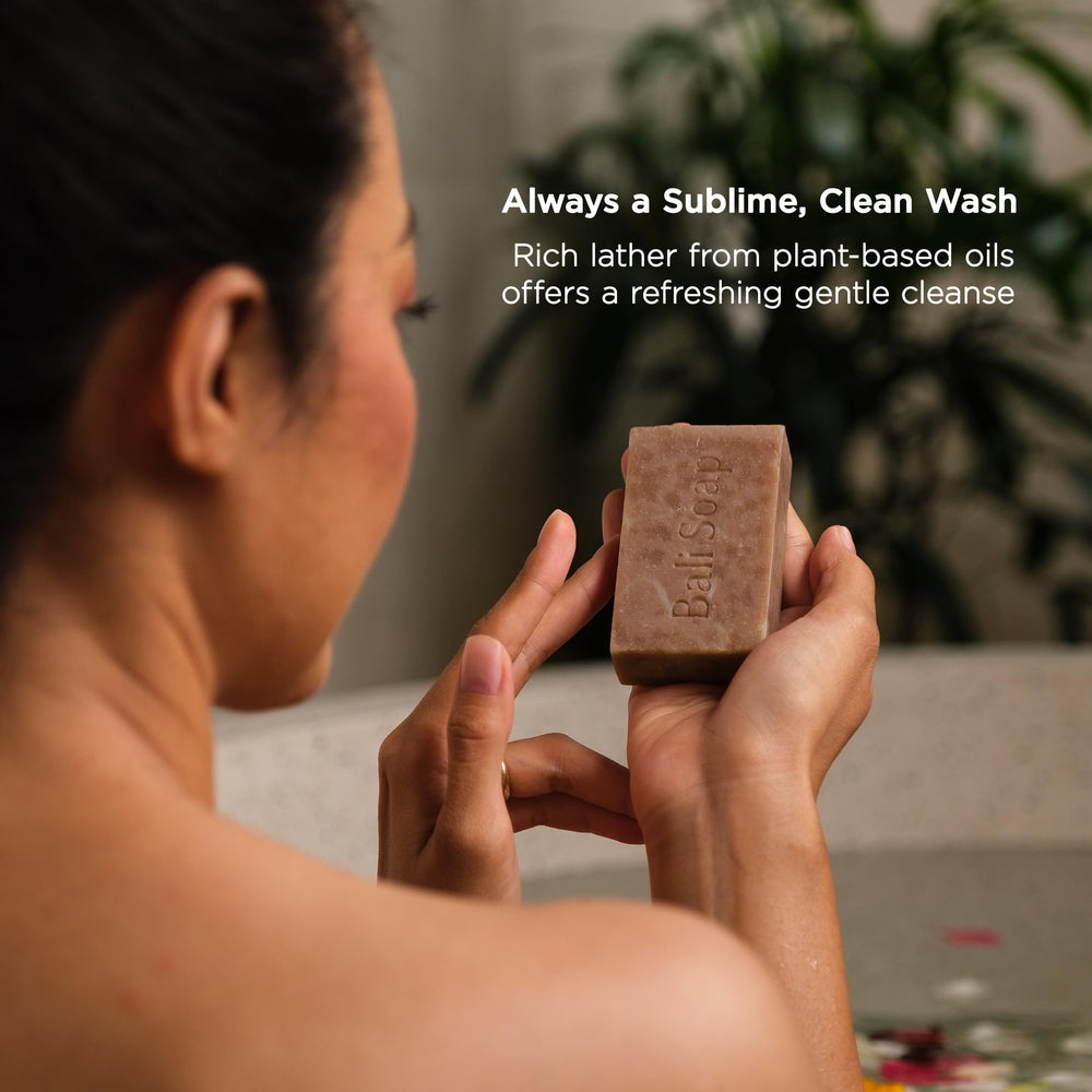 Bali Soap bar next to hand for size comparison and practical portioning