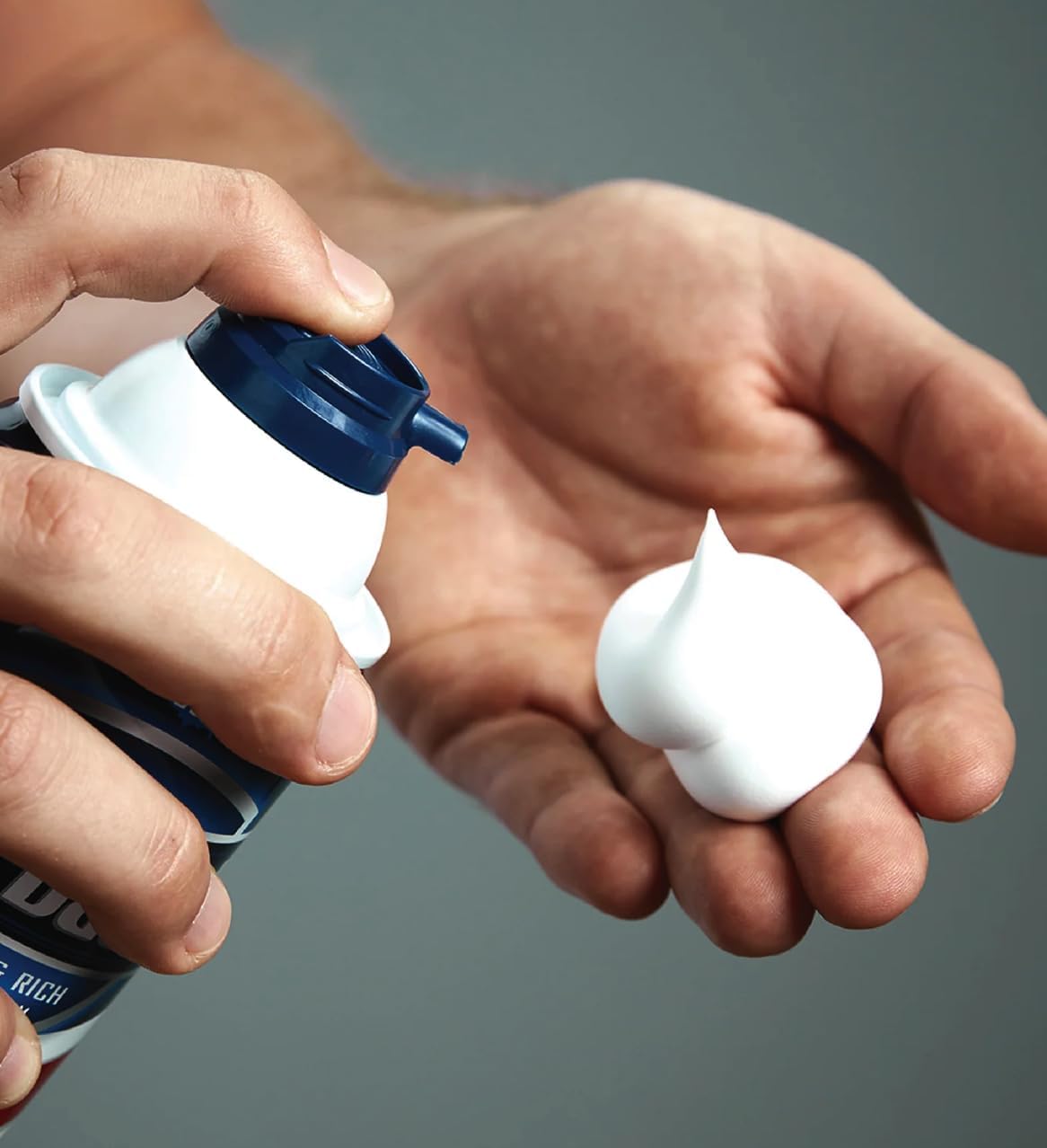 Barbasol can in hand showing size and value for frequent shavers