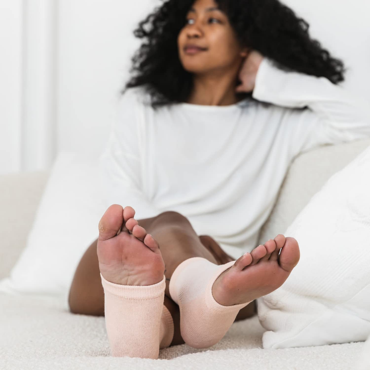 Bare August heel sleeve worn with sandal for day comfort and protection