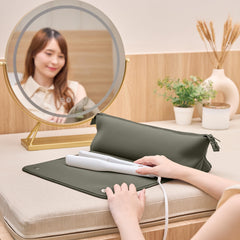 BAREFOOT CARIBOU travel bag holding a full-size flat iron securely inside