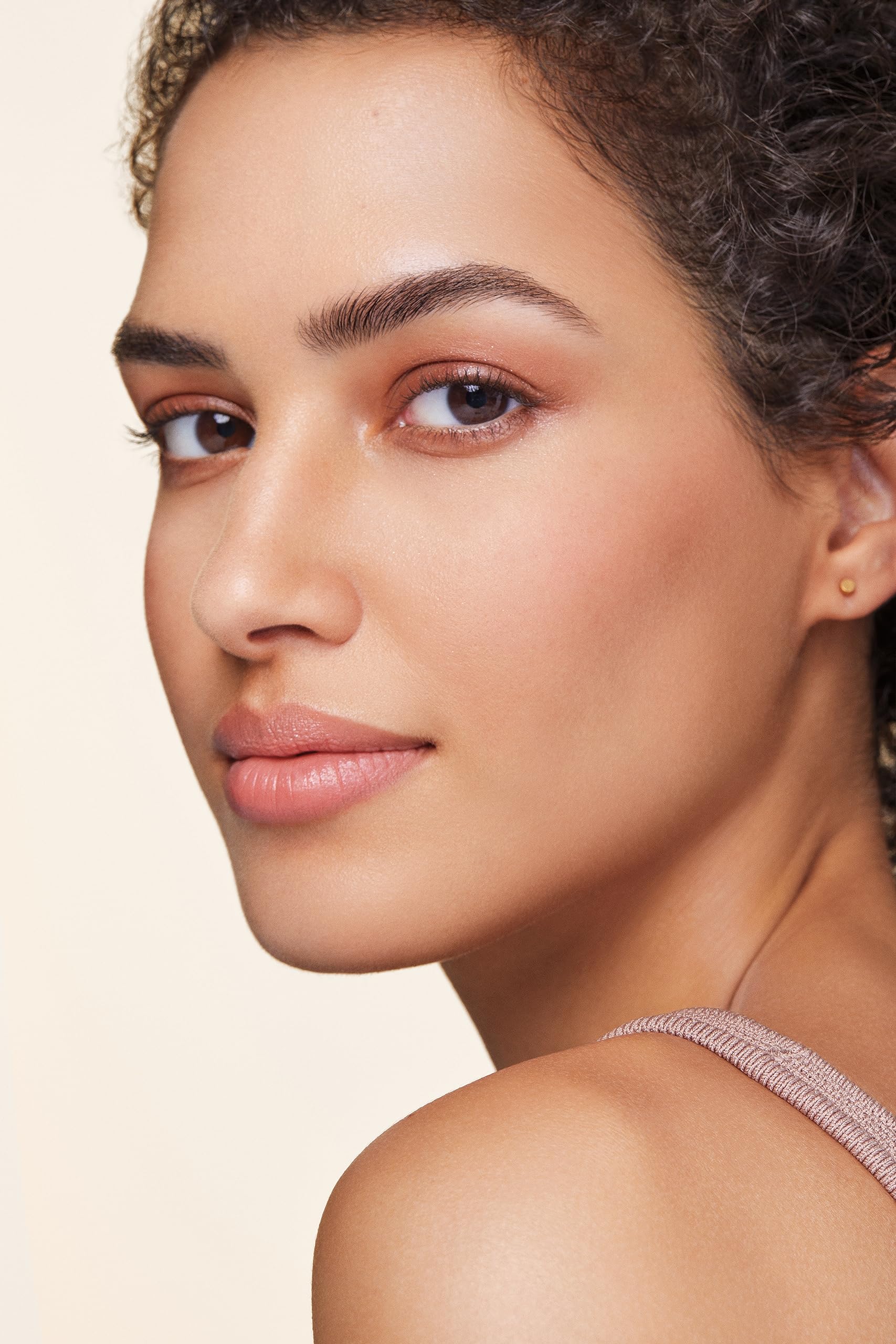 bareMinerals spoolie blending product on eyebrow for natural seamless finish