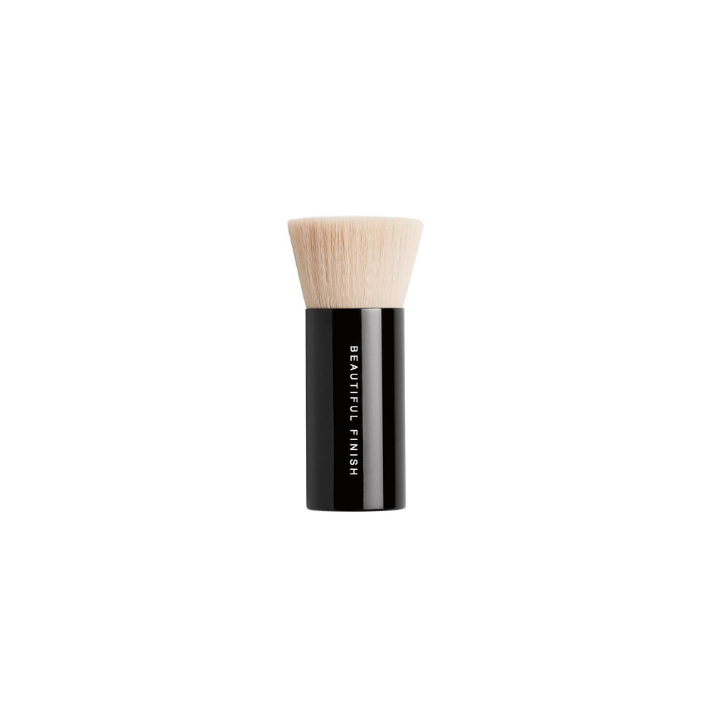 bareMinerals brush fitting into foundation lid for convenient pickup and storage