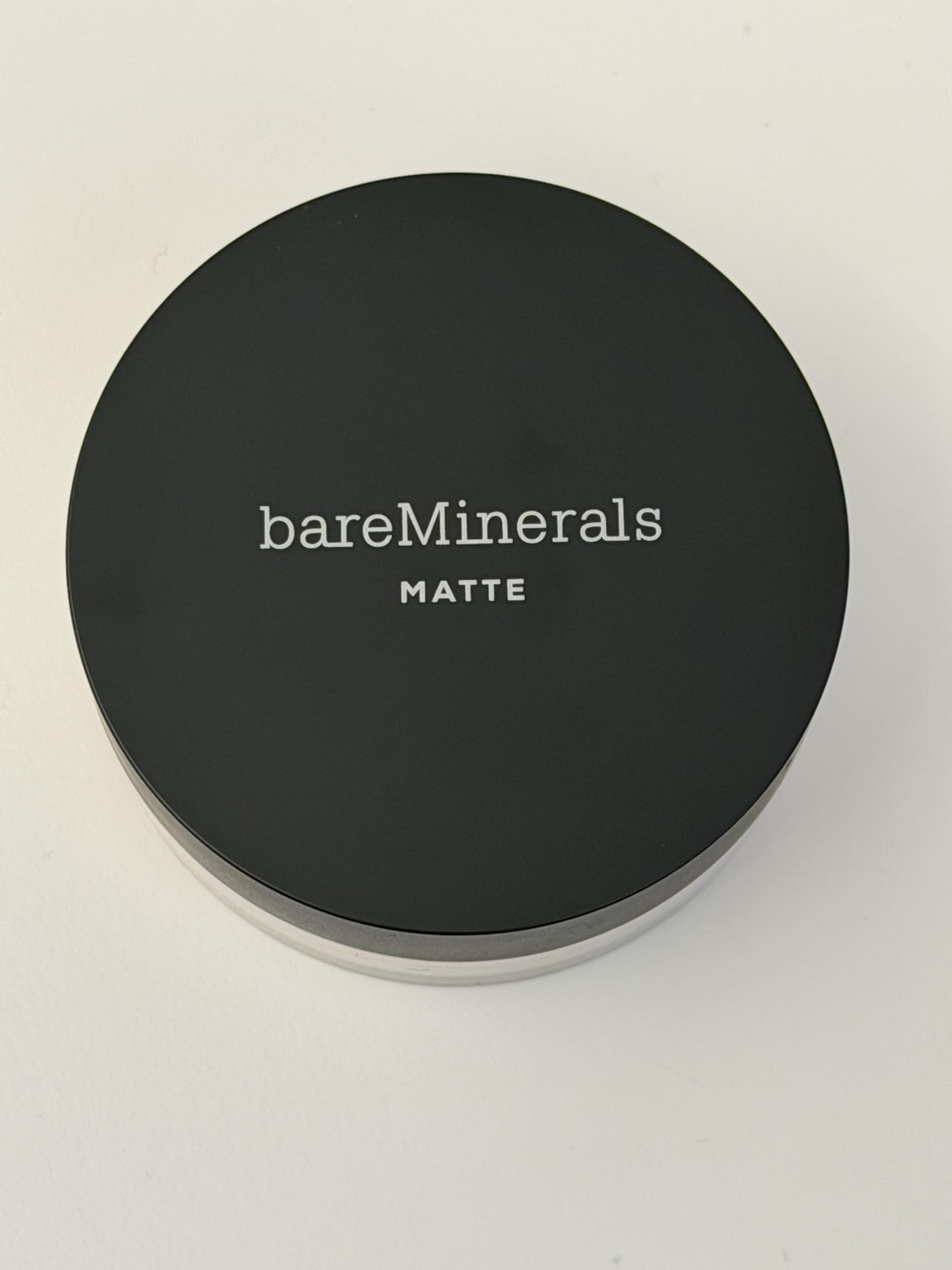 bareMinerals puff application showing buildable coverage benefit