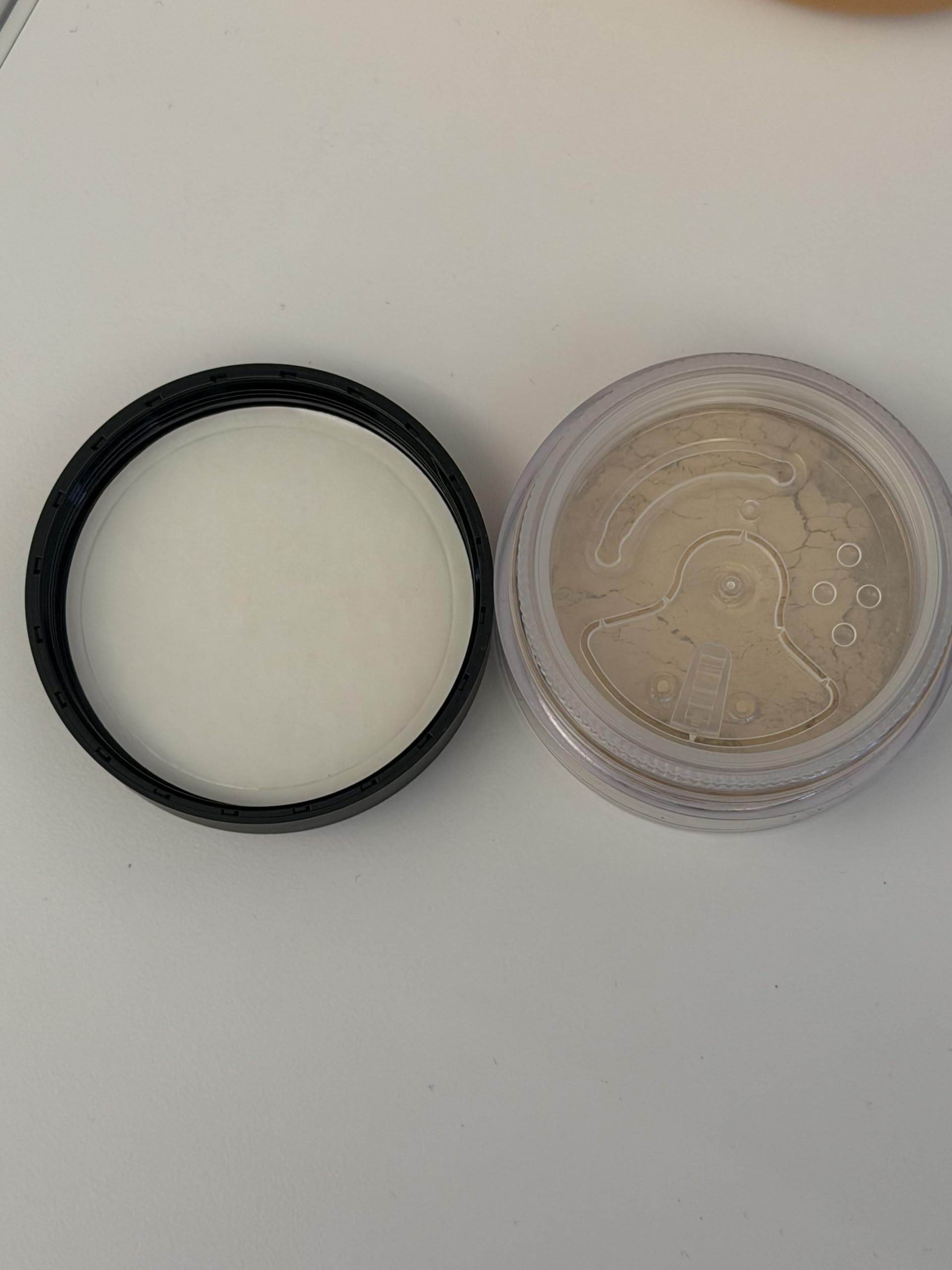 bareMinerals size comparison next to ruler showing compact travel-friendly jar