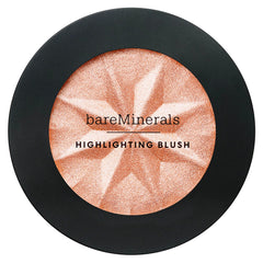 bareMinerals swatches on forearm showing peach glow adaptability and buildable luminosity