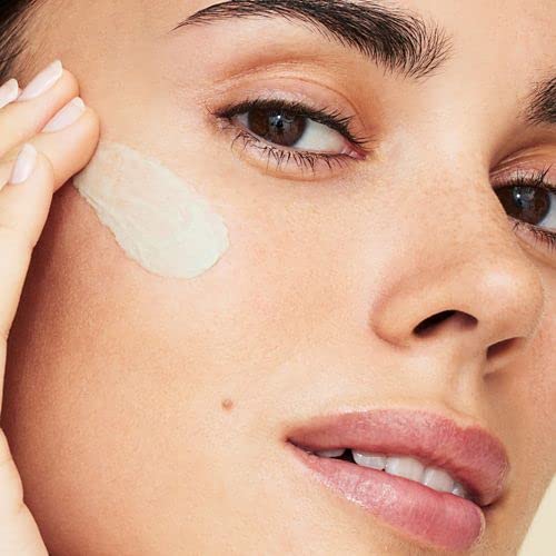 bareMinerals product in hand to show 1 oz scale and travel-friendly benefit
