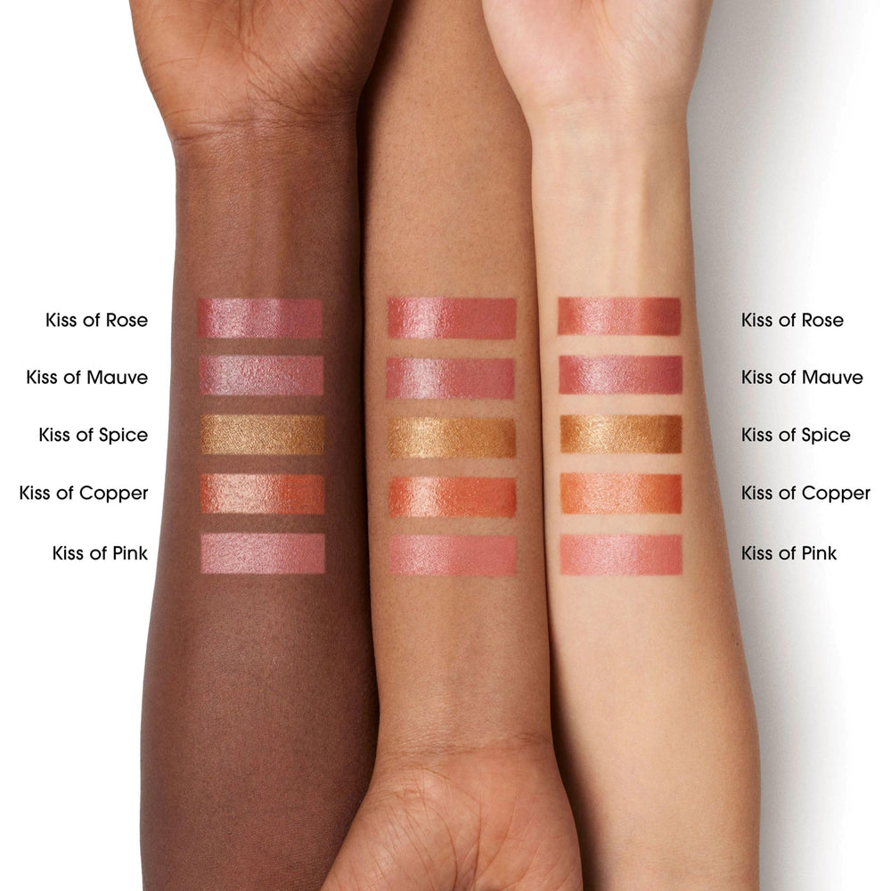 bareMinerals product swatched on hand showing buildable rosy-bronze benefit