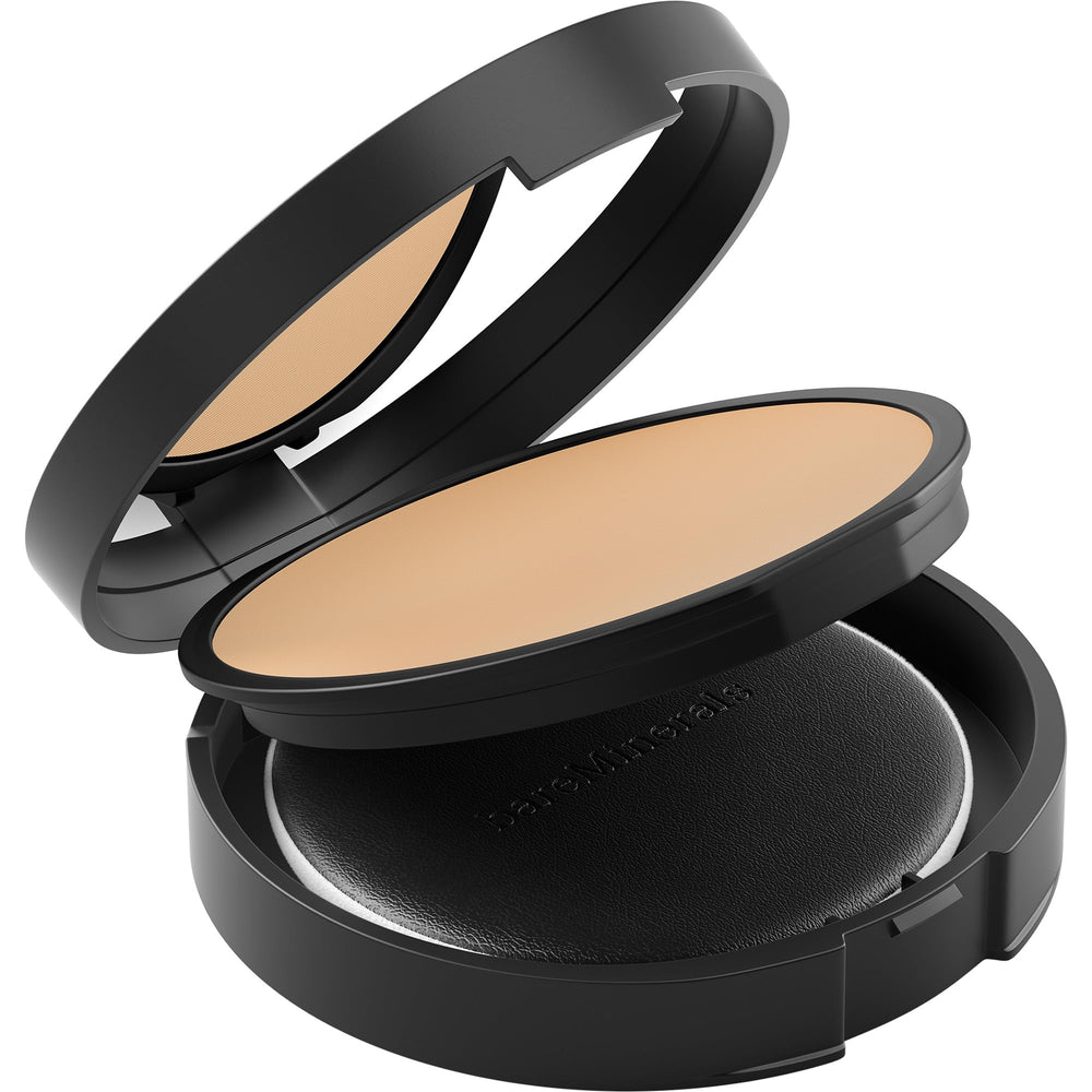 bareMinerals puff applying powder to nose area for targeted shine control