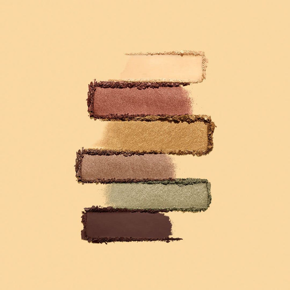 bareMinerals palette in hand to show compact size and travel-friendly design