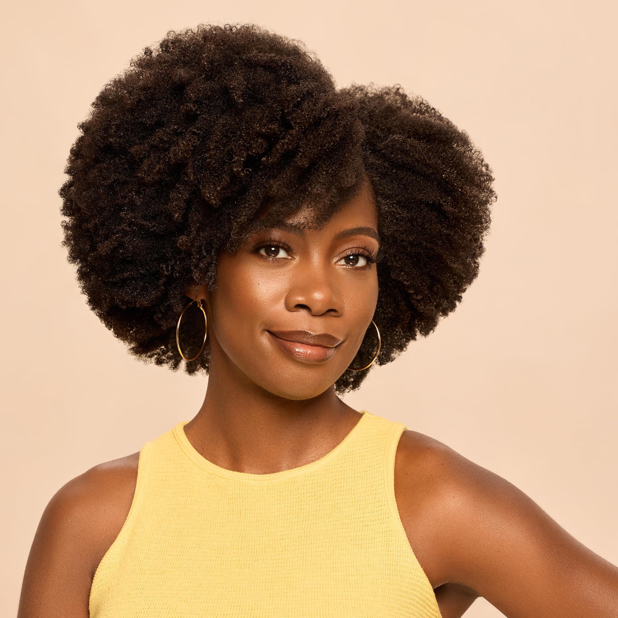 BASK & LATHER applied on curly hair demonstrating defined frizz-free curls