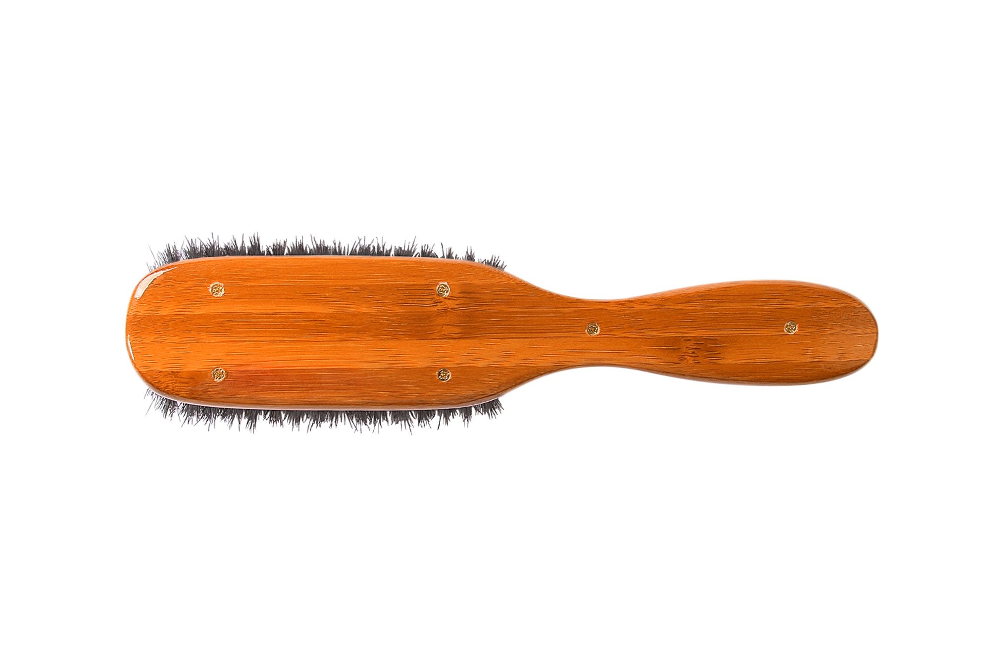 Bass brush resting on bathroom counter in lifestyle scene for daily grooming