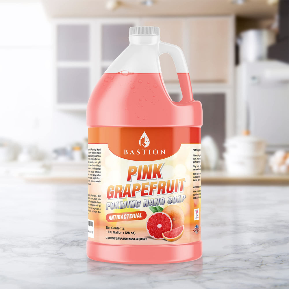 Hand holding Bastion gallon for scale showing one-gallon value and convenience