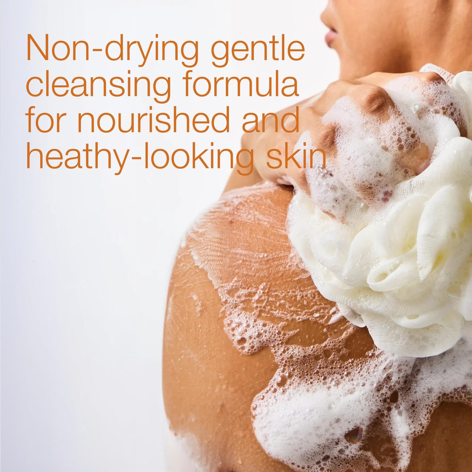 Bath & Body Works body wash in hand under shower emphasizing gentle, non-drying formula