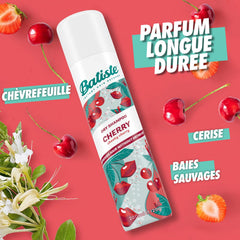 Batiste sprayed onto roots in use to instantly absorb oil and boost volume