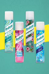 Batiste powder spray texture mid-air illustrating oil absorption action