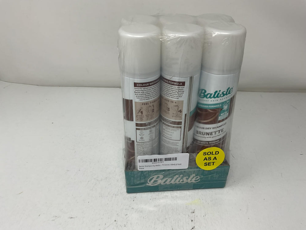 Hand holding Batiste can to show portable 6.73 oz size convenience