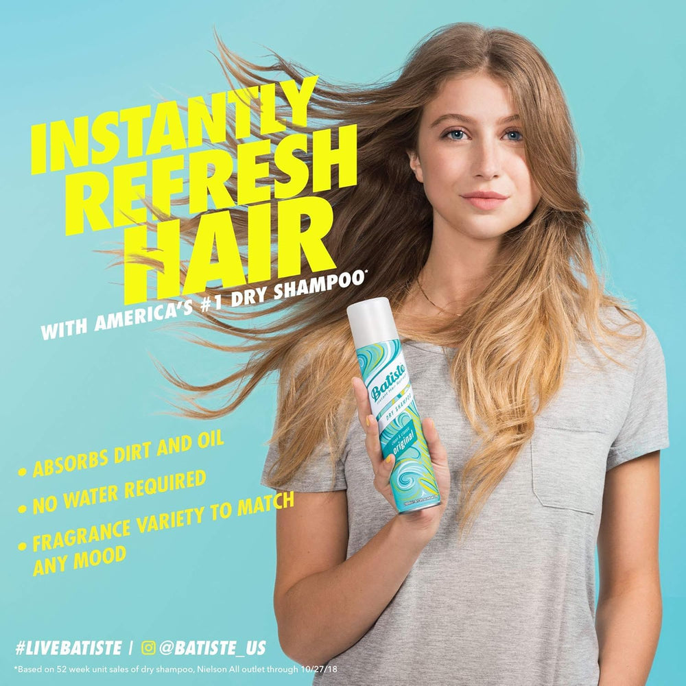Woman outdoors using Batiste with improved hair volume and fresh scent benefit