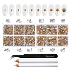 BEADSLAND wax pencils and tweezer beside scattered rhinestones for easy placement