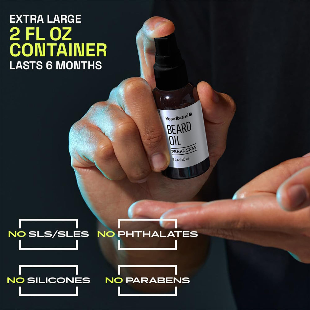 Beardbrand label close-up listing jojoba and vitamin E for nourishment benefit