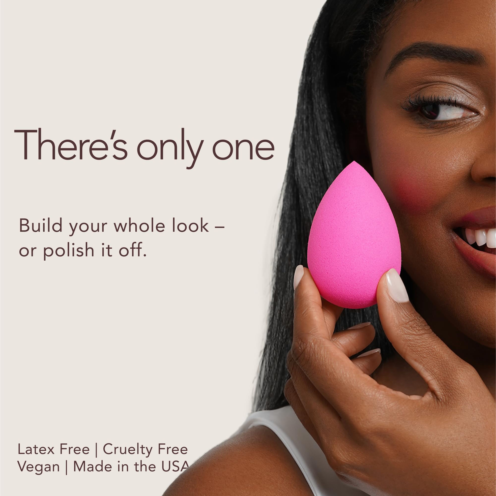 beautyblender damp sponge being squeezed to show aqua-activated expansion benefit