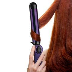 Bed Head wand creating loose waves on hair demonstrating voluminous finish
