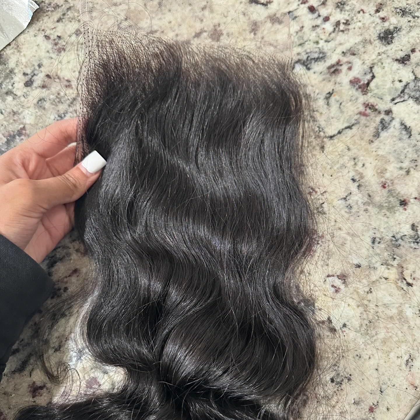BEEOS styled body wave closure on mannequin illustrating wearable final look