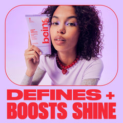 being INC applying cream to damp curls for defined styling