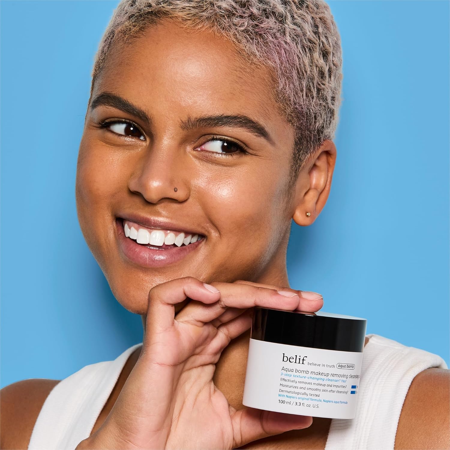 belif balm on fingers melting to oil demonstrating easy makeup removal