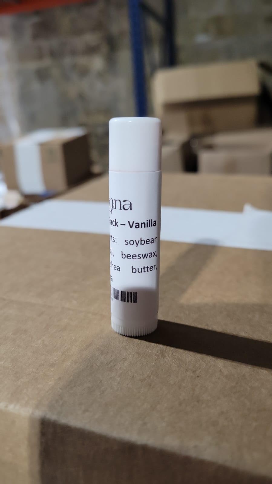 Belladonna open tube tip detail showing smooth balm surface and application benefit