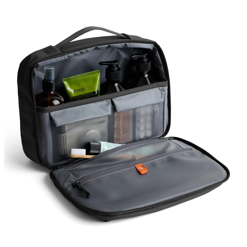 Bellroy opened clamshell interior showing organized pockets for quick visibility and packing