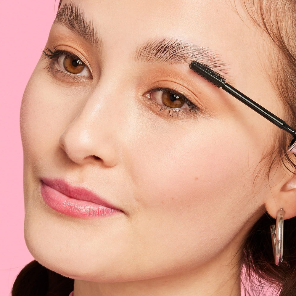 Benefit close-up of wand tip demonstrating precise brow grooming control