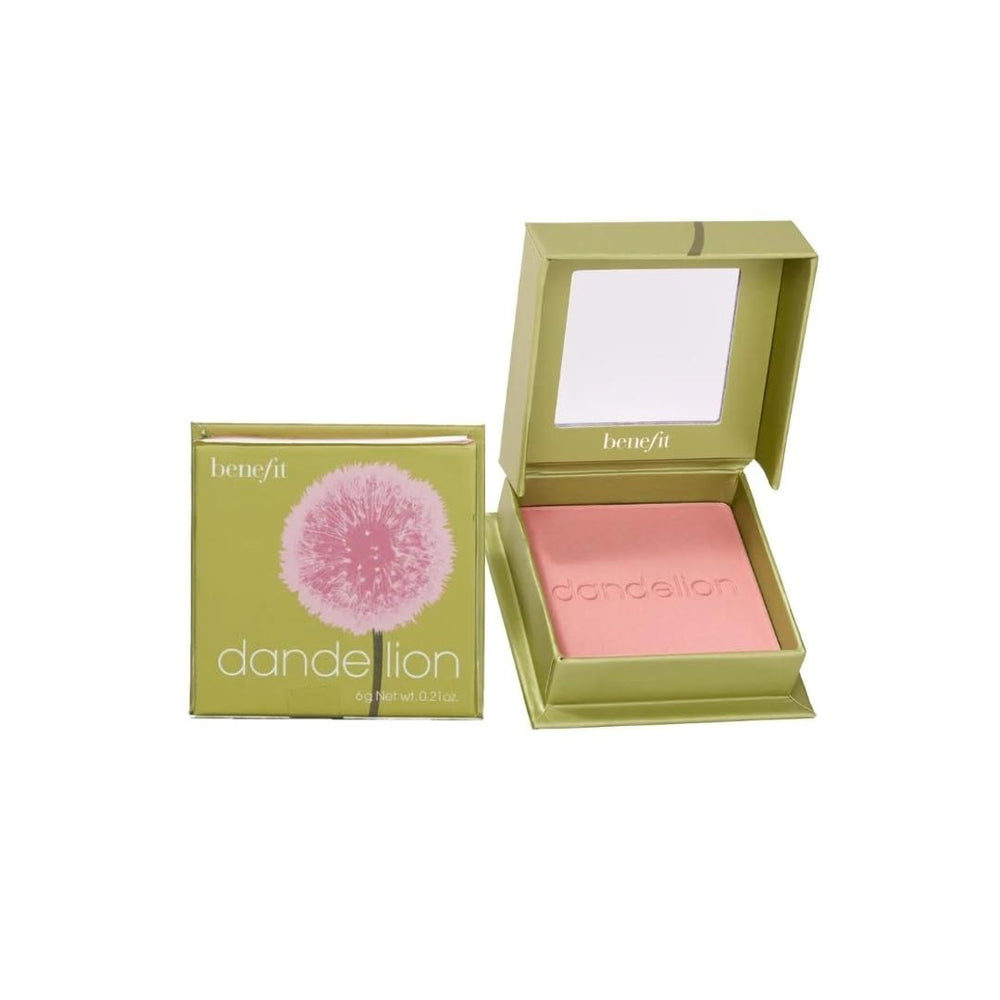 Benefit Dandelion compact next to coin for scale showing travel-friendly size and convenient portability benefit