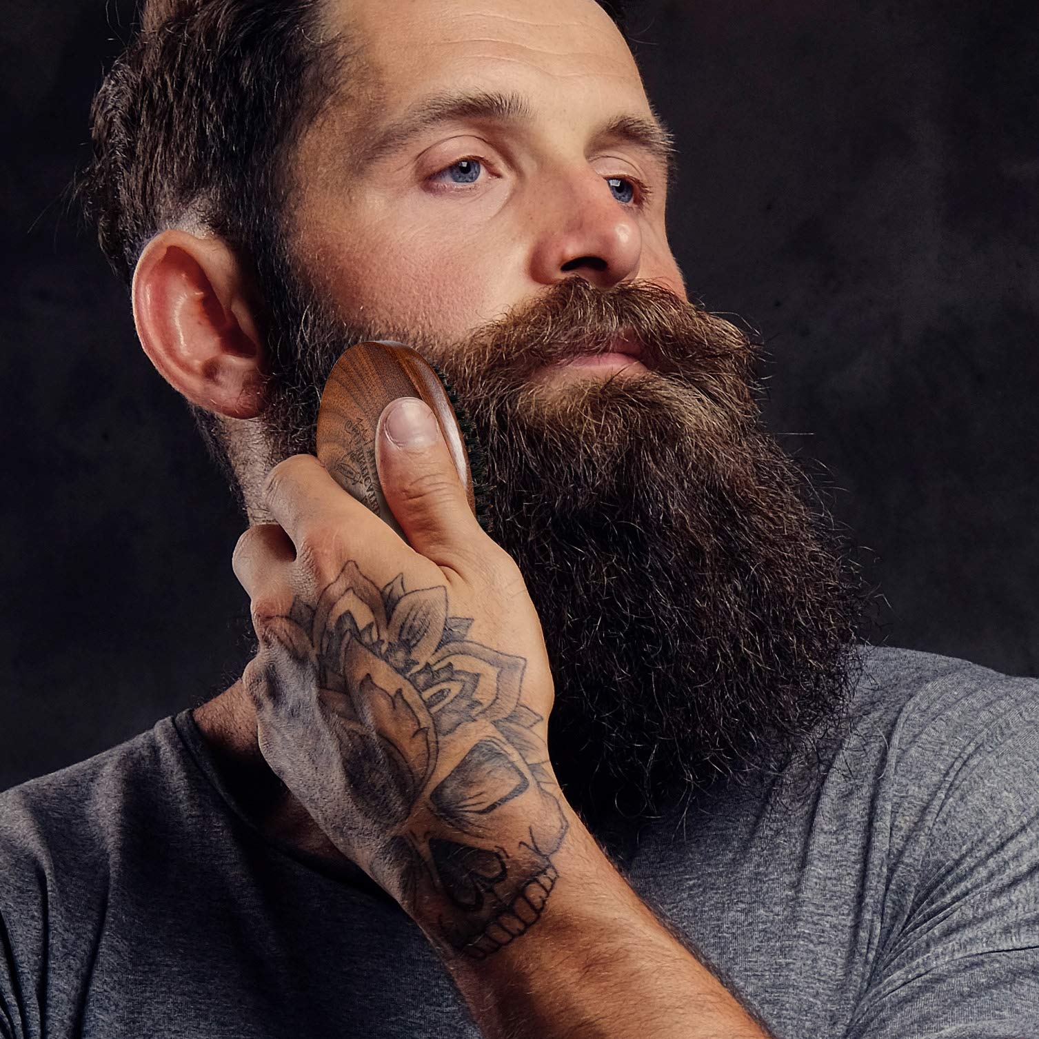 BFWood lifestyle scene of man grooming beard showing polished, military look