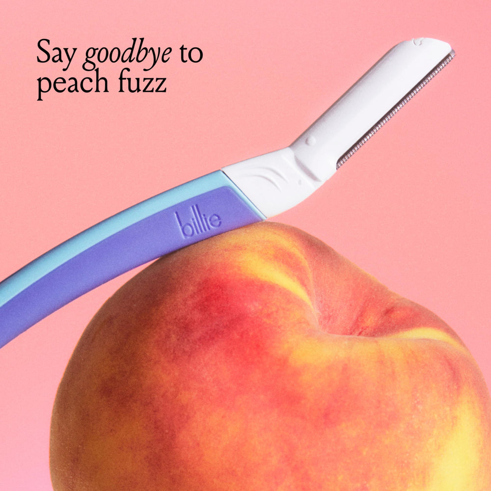 Billie razor shaping brows precisely for neat, defined arches