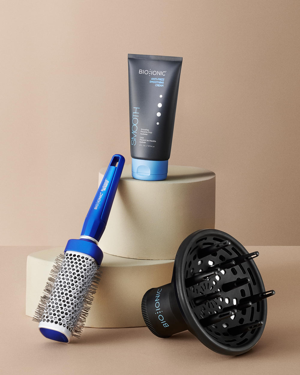BIO IONIC brush next to ruler for compact 1 inch size comparison