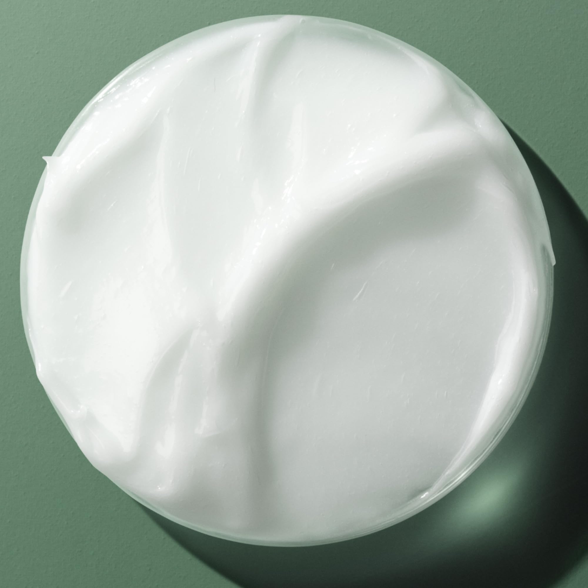 Close-up of Biolage product texture showing lightweight feel and shine