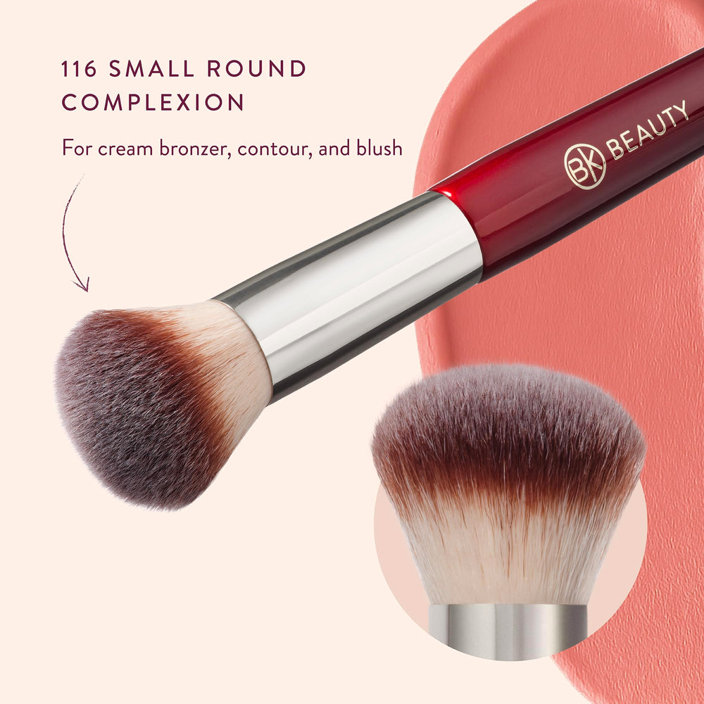 BK BEAUTY brush held in hand showing compact size for travel